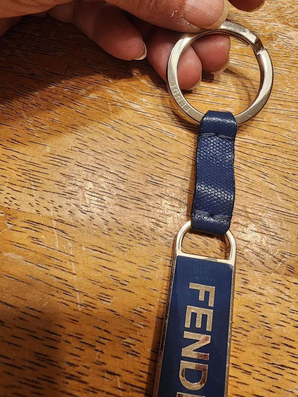 blue leather Fendi logo plaque keychain features silver-tone hardware